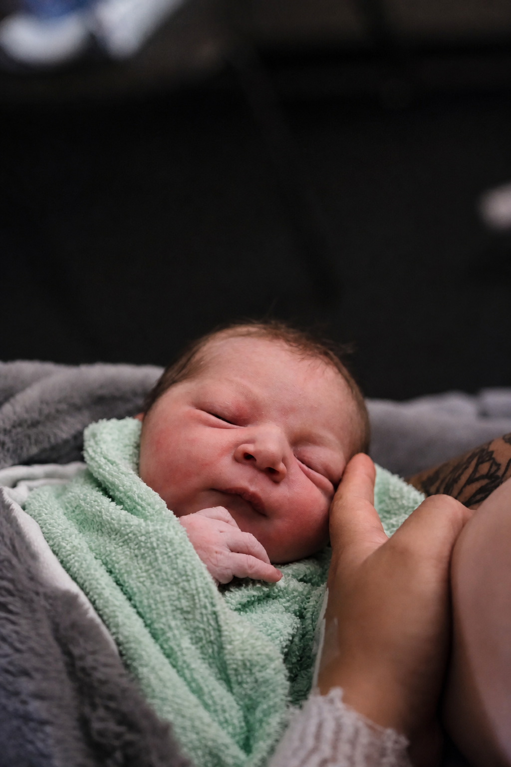 Peaceful newborn wrapped in a blanket